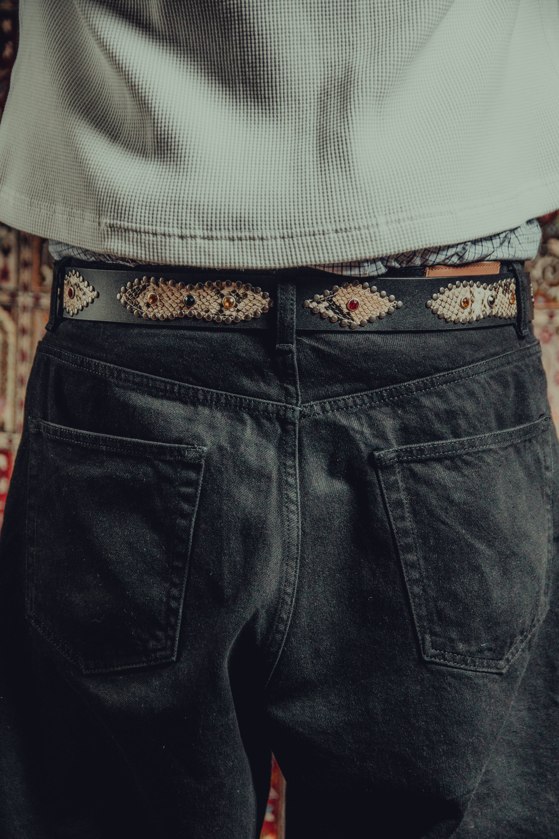 Studded snakeskin belt