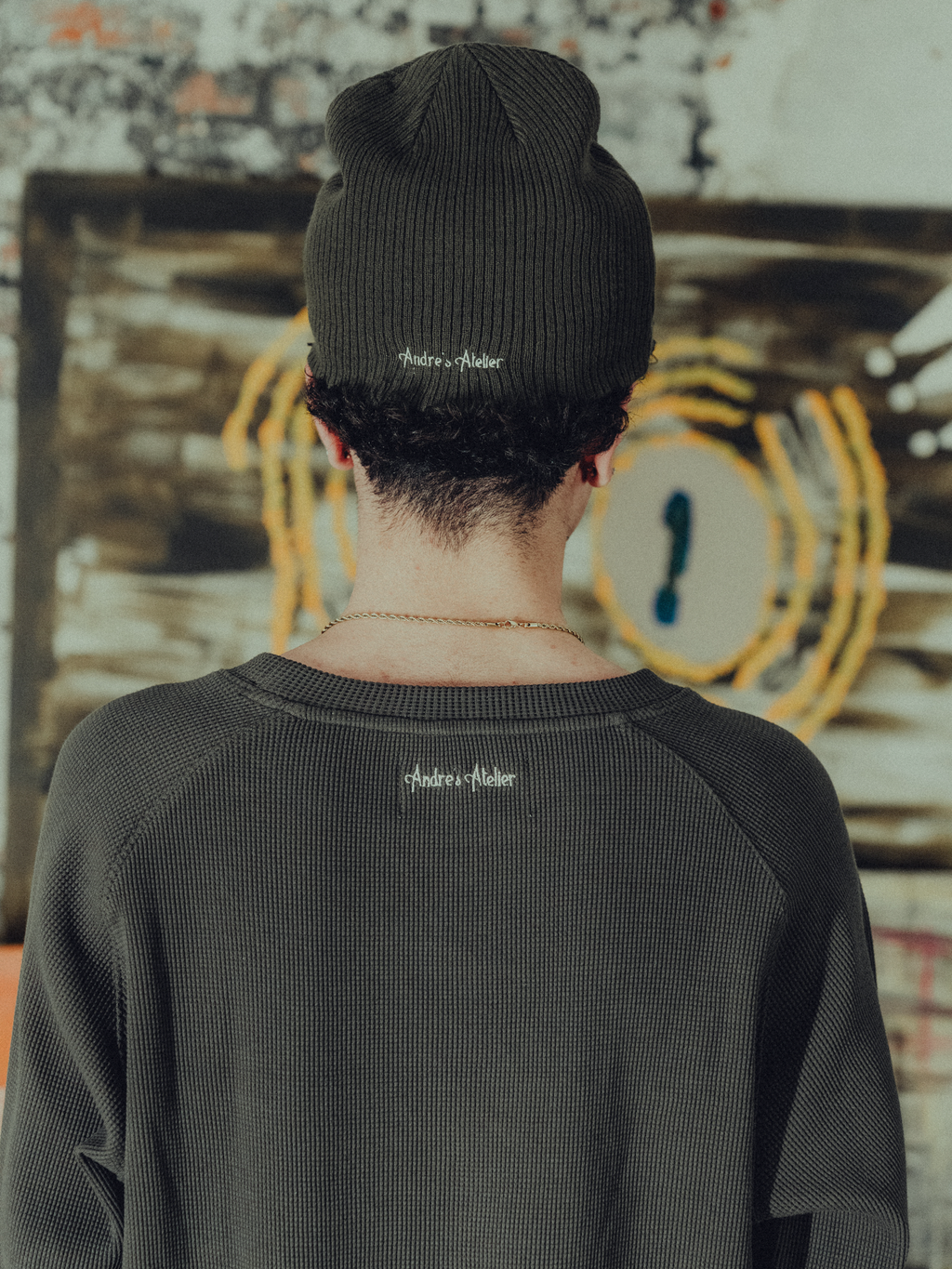 army green ribbed beanie back view on model