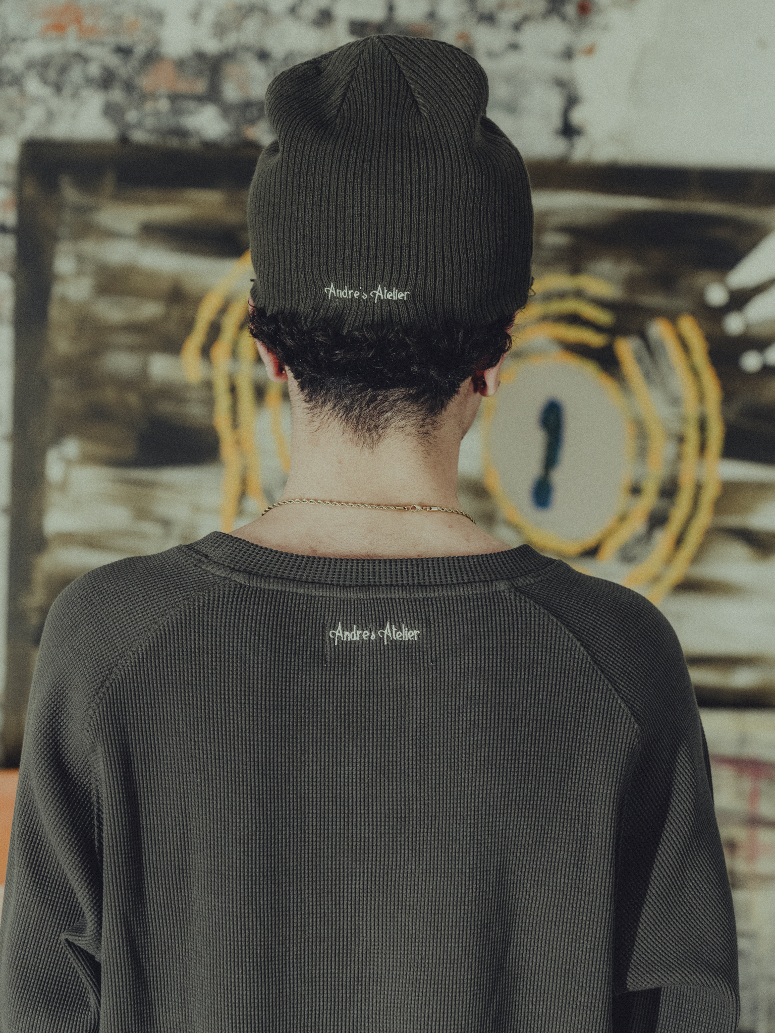 army green ribbed beanie back view on model