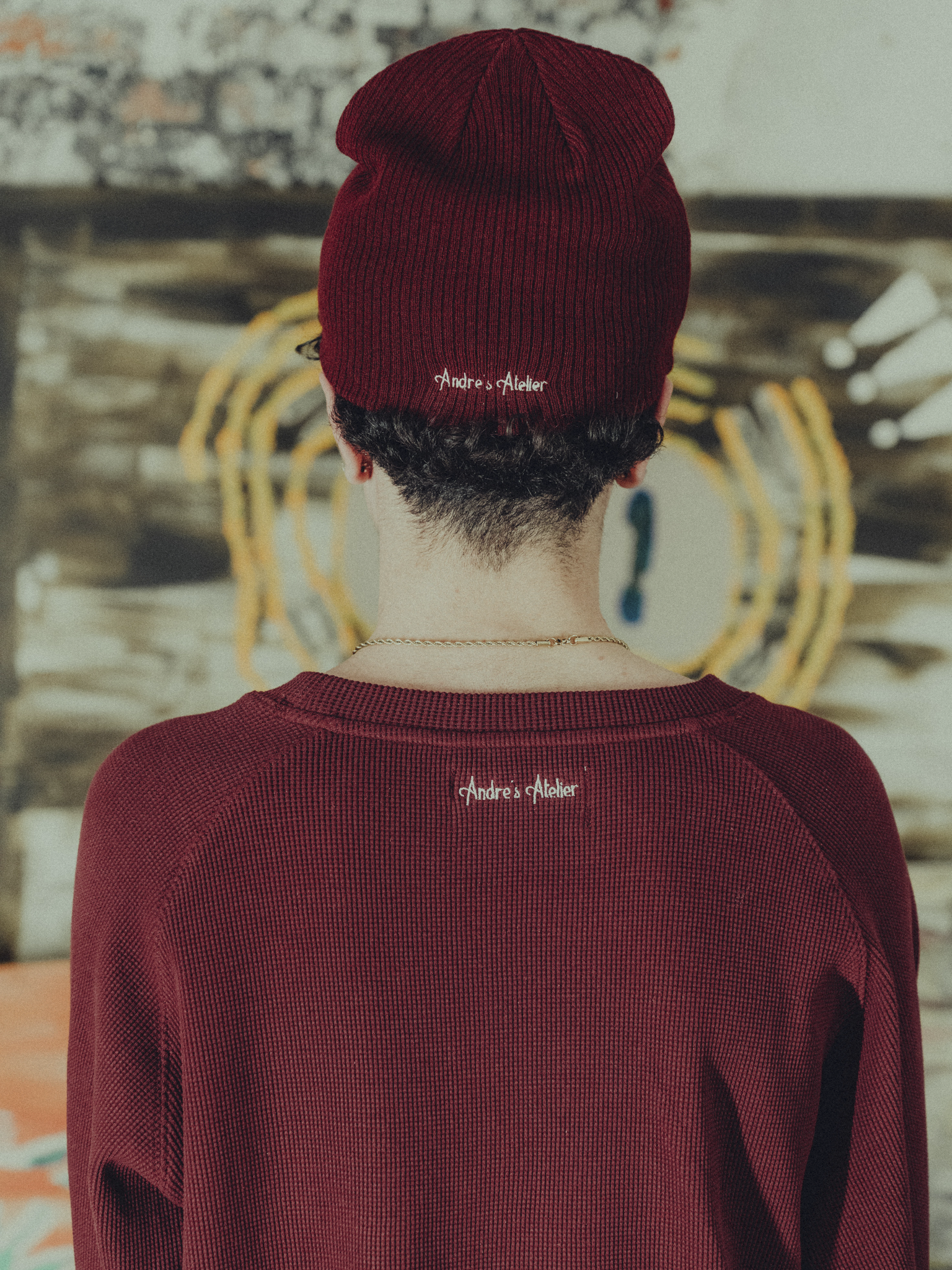 burgundy ribbed beanie back view on model