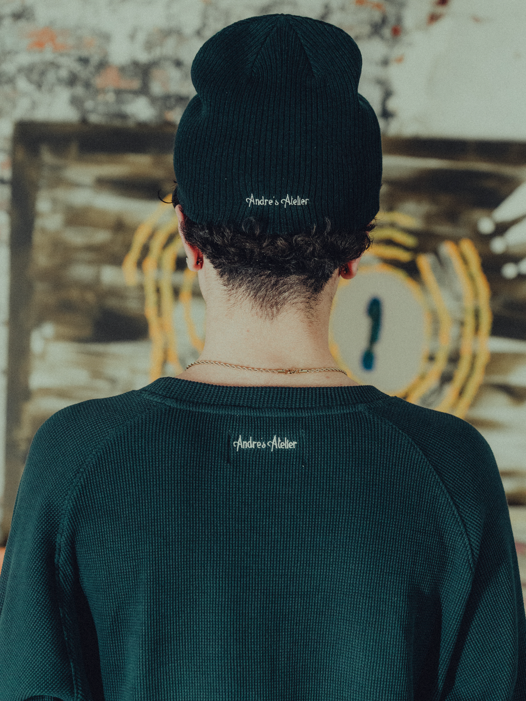 Navy ribbed beanie back view on model