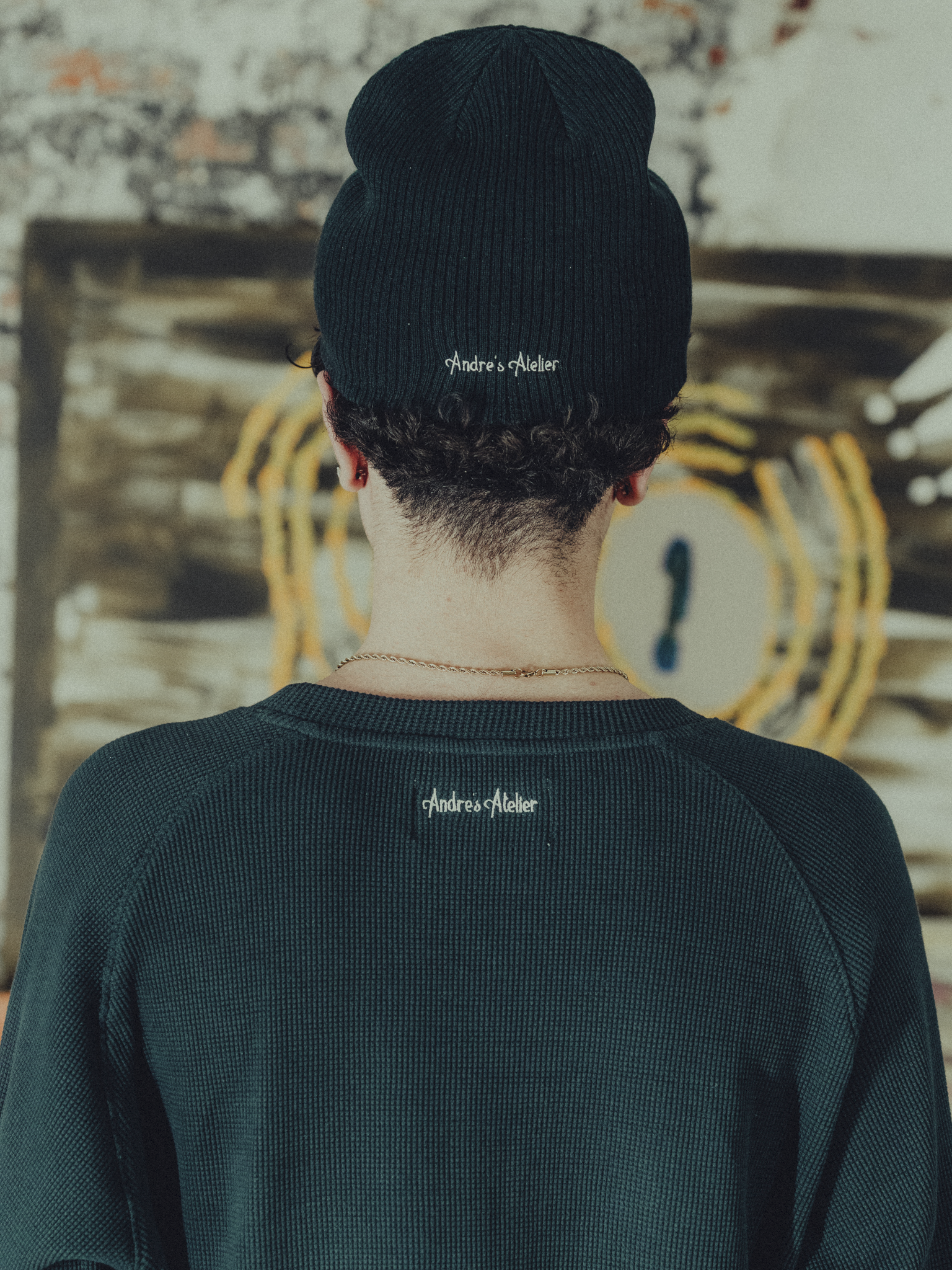 Navy ribbed beanie back view on model