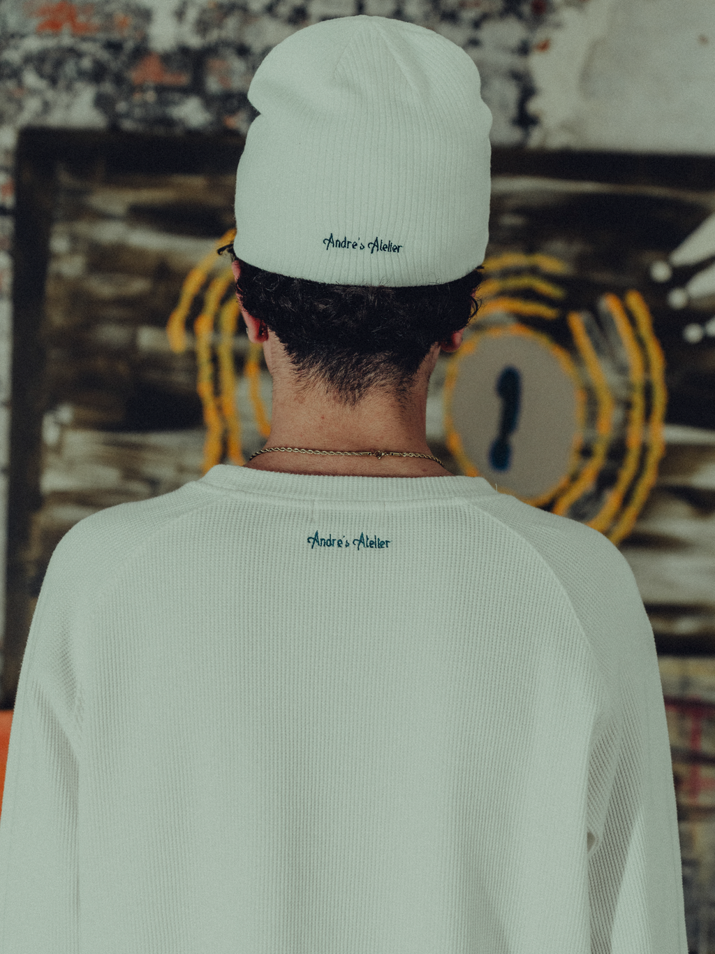 white ribbed beanie back view on model