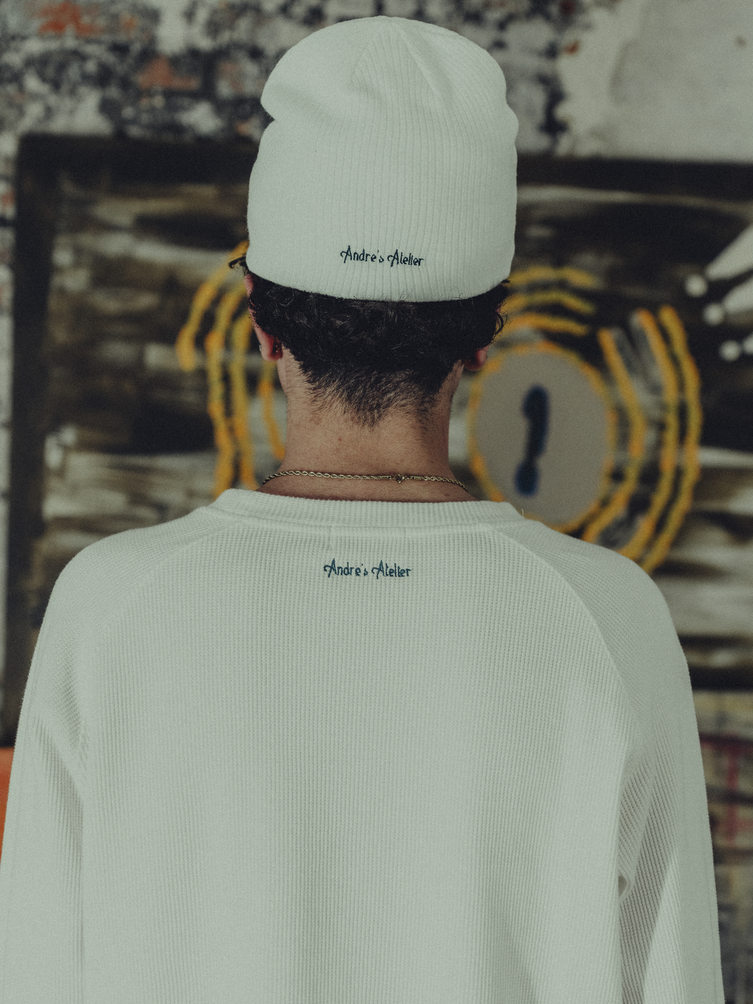 white ribbed beanie back view on model