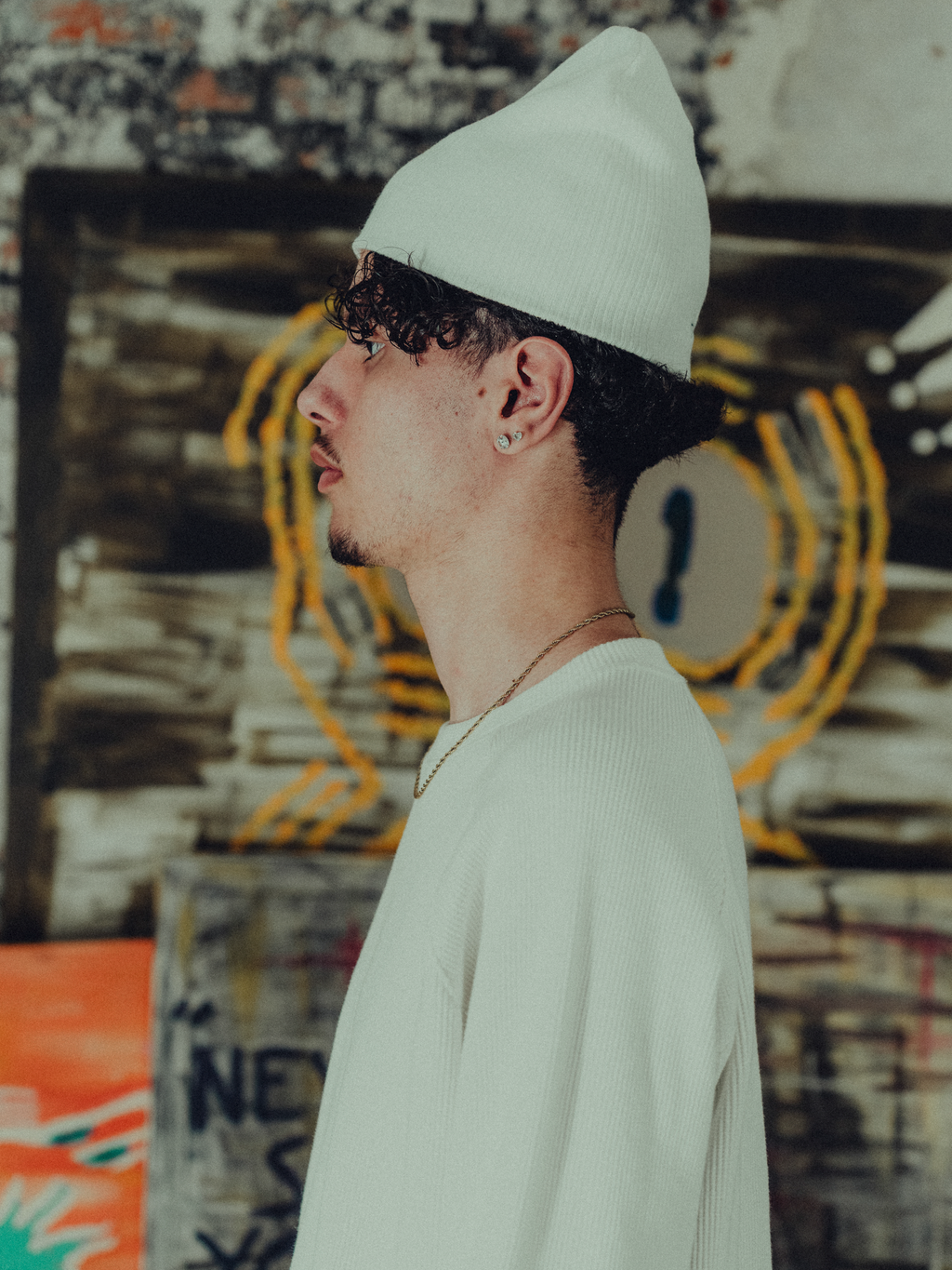 white ribbed beanie side view on model