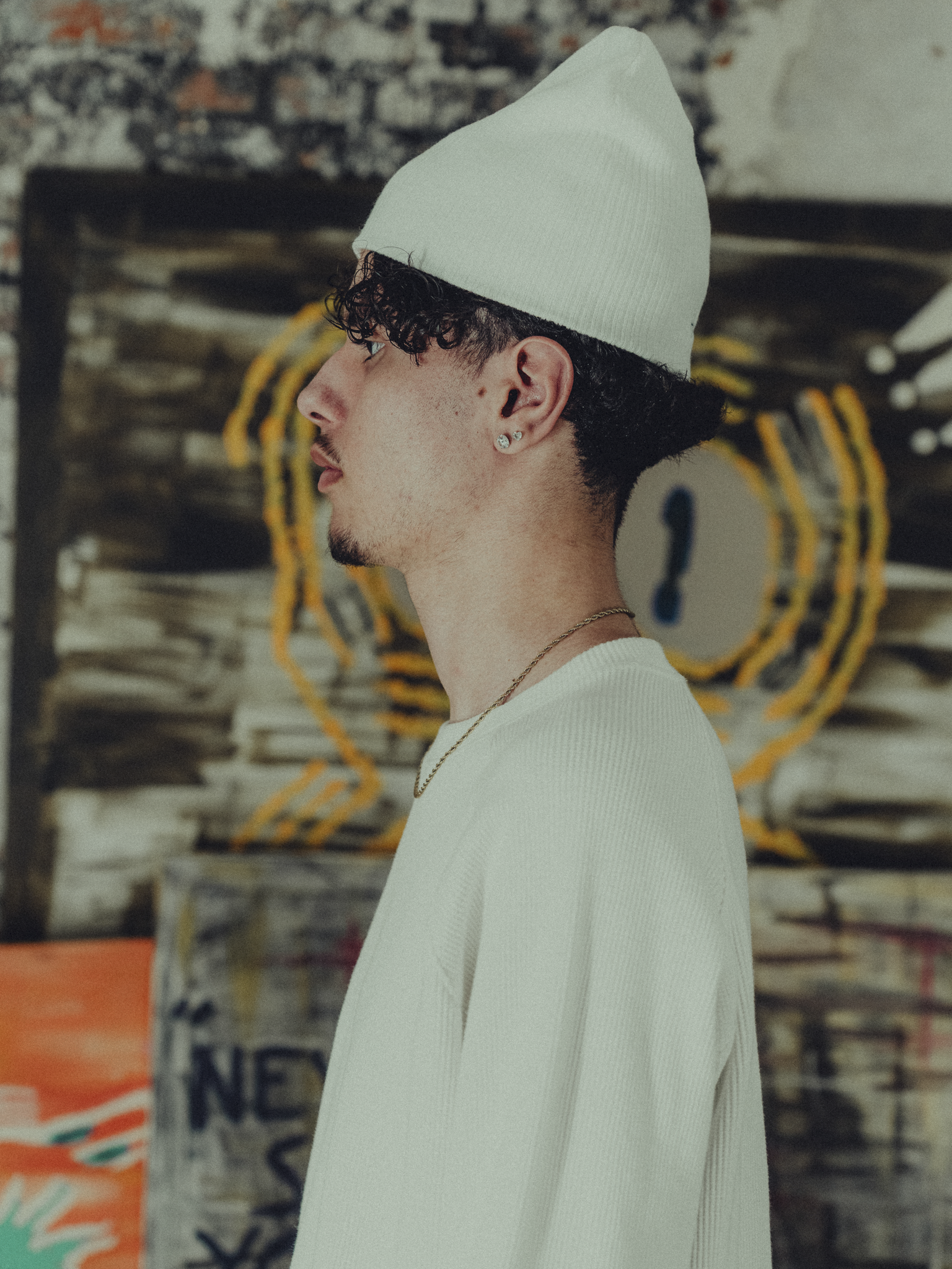 white ribbed beanie side view on model
